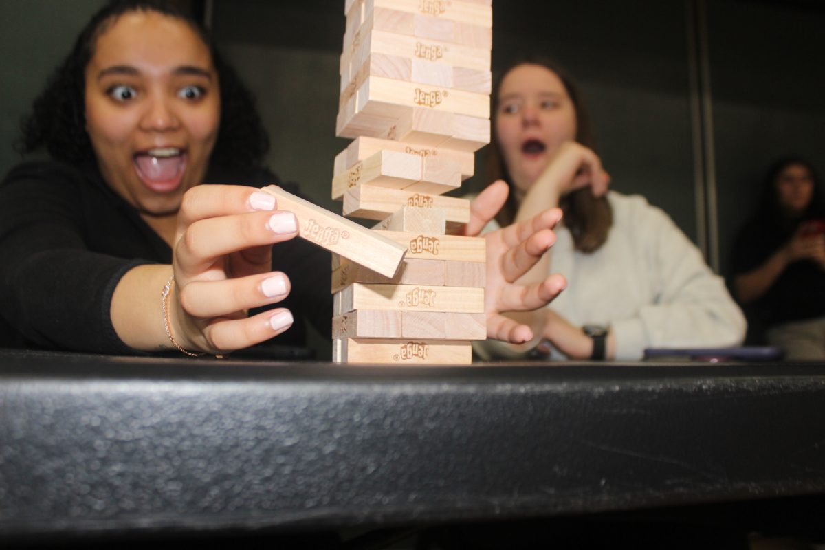 Students playing Jenga at the 5th annual Sports Bash at the Clark Athletic Center at SUNY Old Westbury on April 13, 2026. PHOTO BY: MICHELLE MORENO